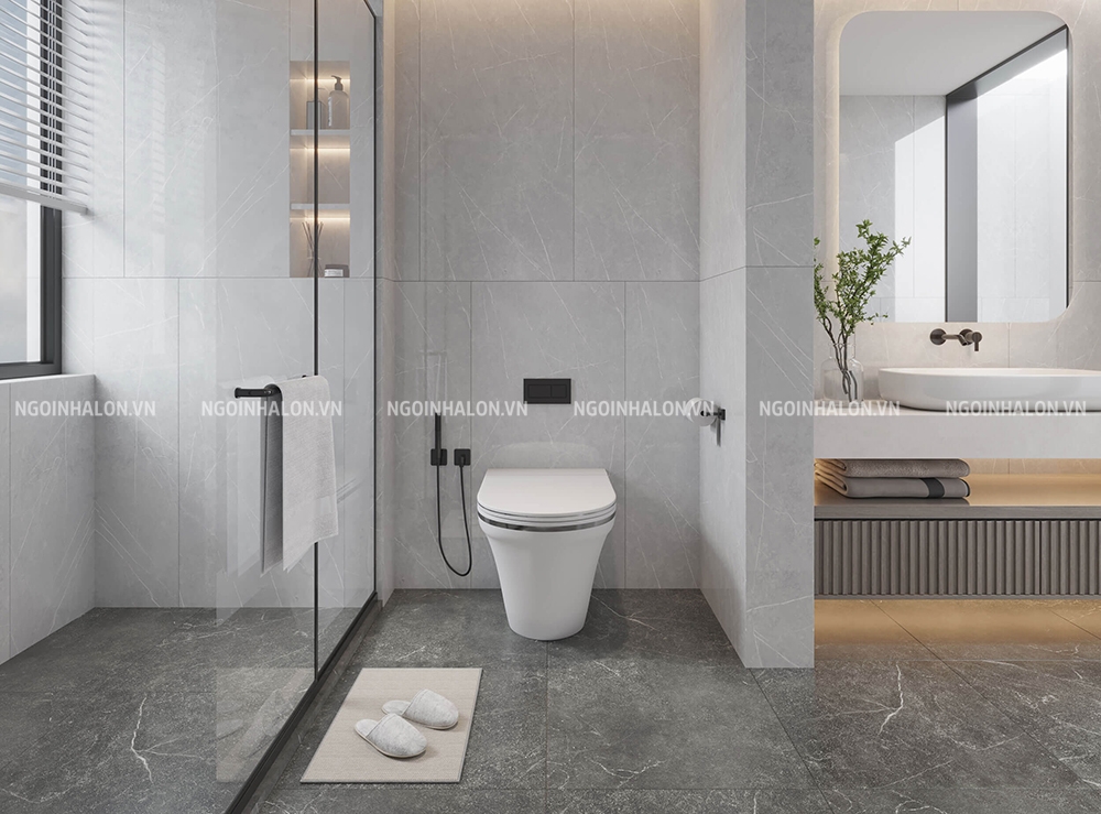 Phối gạch lát nền màu xám với tường trắng giúp phòng tắm trông nổi bật hơn
